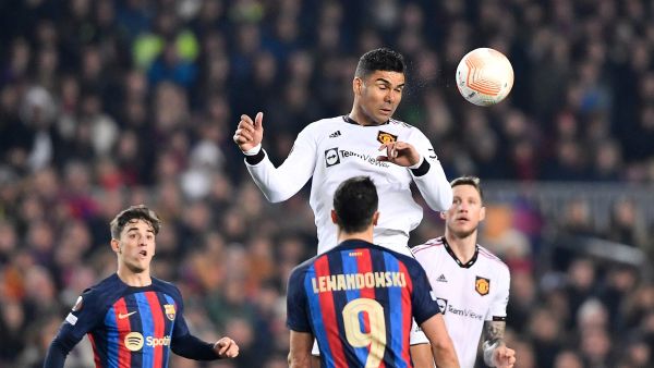 Manchester United's Brazilian midfielder Casemiro heads the ball during the UEFA Europa League round of 32 first-leg football match between FC Barcelona and Manchester United at the Camp Nou stadium in Barcelona, on February 16, 2023. (Photo by Pau BARRENA / AFP)