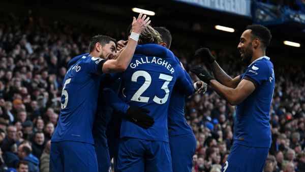 Chelsea's German midfielder Kai Havertz celebrates with teammates after scoring the opening goal during the English Premier League football match between Chelsea and Crystal Palace at Stamford Bridge in London on January 15, 2023. (Photo by Ben Stansall / AFP)