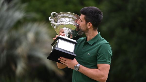 Serbia's Novak Djokovic poses with the Norman Brookes Challenge Cup trophy in Melbourne on January 30, 2023, after winning the Australian Open tennis tournament's mens' singles final against Greece's Stefanos Tsitsipas. (Photo by WILLIAM WEST / AFP) 