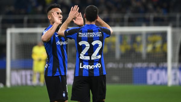 Inter Milan's Armenian midfielder Henrikh Mkhitaryan (R) celebrates scoring his team's second goal during the Italian Serie A football match between Inter Milan and Udinese Calcio at San Siro stadium in Milan on February 18, 2023. (Photo by ANDREAS SOLARO / AFP)