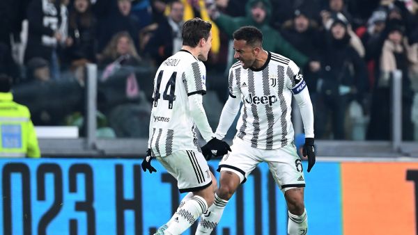 Juventus' Brazilian defender Danilo (R) celebrates with Juventus' Italian midfielder Nicolo Fagioli after scoring his team's third goal during the Italian Serie A football match between Juventus and Atalanta at the Juventus Stadium in Turin, on January 22, 2023. (Photo by Isabella BONOTTO / AFP)