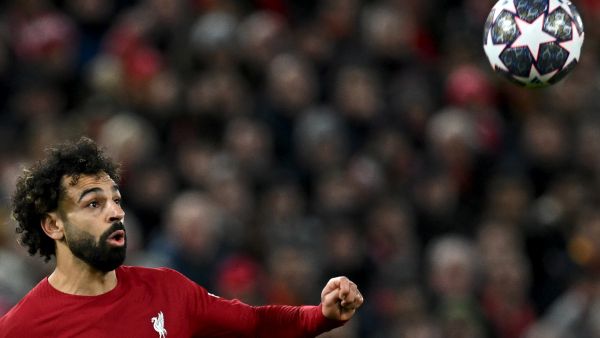 Liverpool's Egyptian striker Mohamed Salah eyes the ball during the UEFA Champions League last 16 first leg football match between Liverpool and Real Madrid at Anfield in Liverpool, north west England on February 21, 2023. (Photo by Paul ELLIS / AFP)