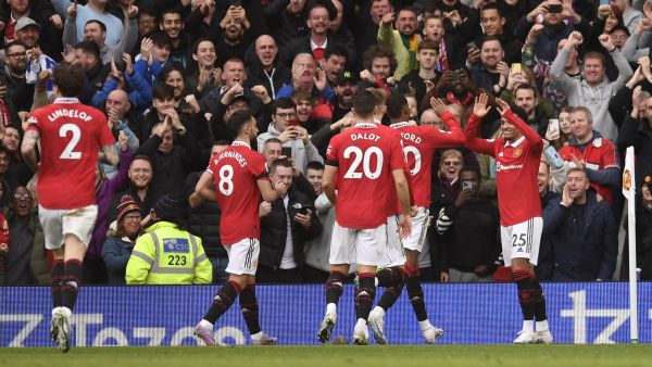Manchester United's English striker Jadon Sancho (R) celebrates scoring the team's third goal during the English Premier League football match between Manchester United and Leicester City at Old Trafford in Manchester, north west England, on February 19, 2023. (Photo by Oli SCARFF / AFP)