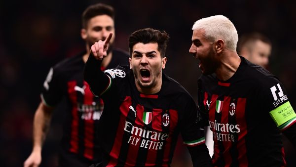 AC Milan's Spanish midfielder Brahim Diaz (C) celebrates with AC Milan's French defender Theo Hernandez after opening the scoring during the UEFA Champions League round of 16, first leg football match between AC Milan and Tottenham Hotspur on February 14, 2023 at the San Siro stadium in Milan. (Photo by Marco BERTORELLO / AFP)
