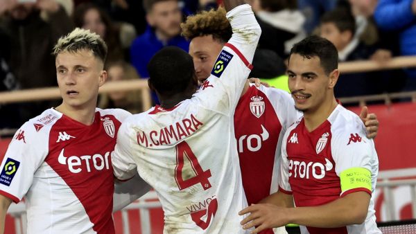 Monaco's French forward Wissam Ben Yedder (R) celebrates with team mates after scoring a goal during the French L1 football match between Monaco and Paris Saint-Germain (PSG) at the Louis II stadium in Monaco on February 11, 2023. (Photo by Valery HACHE / AFP)