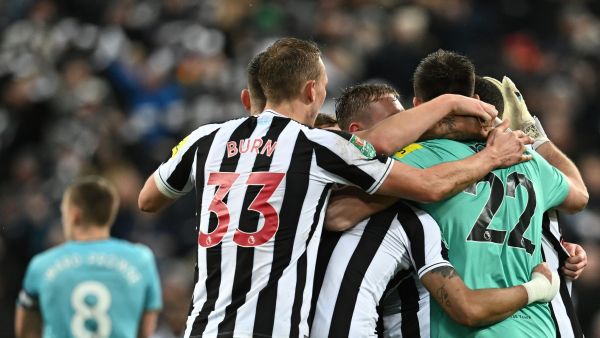 Newcastle United's teammates celebrate at the end of the English League Cup semi final football match between Newcastle United and Southampton at St James's Park stadium in Newcastle, on January 31, 2023. - Newcastle United won 2 - 1 against Southampton. (Photo by Paul ELLIS / AFP)
