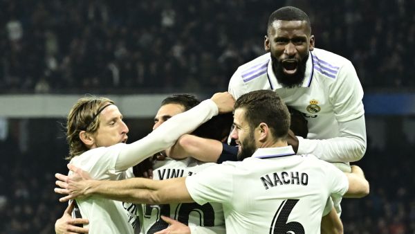 Real Madrid players celebrate their second goal scored by Real Madrid's Brazilian forward Vinicius Junior during the Spanish league football match between Real Madrid CF and Valencia CF at the Santiago Bernabeu stadium in Madrid on February 2, 2023. (Photo by JAVIER SORIANO / AFP)