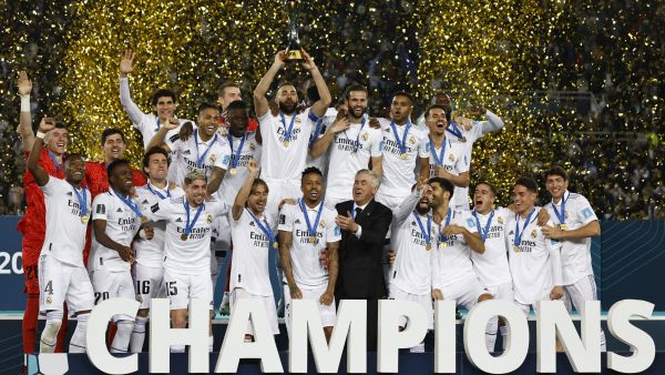 Real Madrid's players celebrate with the trophy at the end of the FIFA Club World Cup final football match between Spain's Real Madrid and Saudi Arabia's Al-Hilal at the Prince Moulay Abdellah Stadium in Rabat on February 11, 2023. Real Madrid lifted the Club World Cup for a record fifth time with a pulsating 5-3 win over Al-Hilal. (Photo by Khaled DESOUKI / AFP)