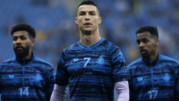 Nassr's Portuguese forward Cristiano Ronaldo (C) warms up ahead of the Saudi Super Cup semi-final football match between Al-Ittihad and Al-Nassr at the King Fahd Stadium in Riyadh on January 26, 2023. (Photo by Fayez NURELDINE / AFP)