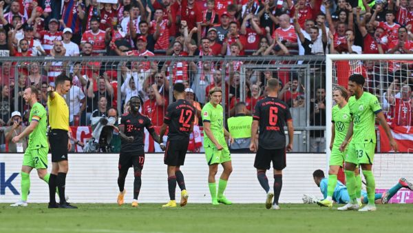 Bayern Munich's German midfielder Jamal Musiala (C) celebrates with team mates his 1-0 during the German first division Bundesliga football match between FC Bayern Munich and VfL Wolfsburg in Munich, southern Germany on August 14, 2022. (Photo by KERSTIN JOENSSON / AFP)