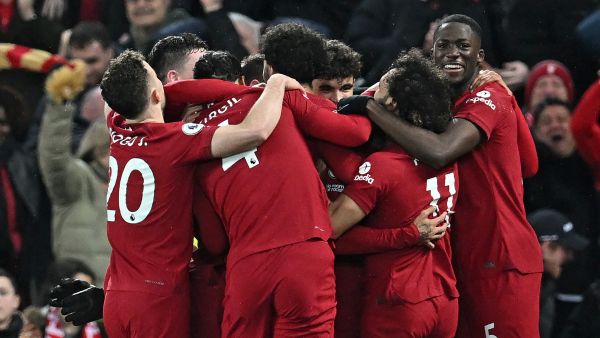  Liverpool's Brazilian striker Roberto Firmino celebrates with teammates after scoring their seventh goal during the English Premier League football match between Liverpool and Manchester United at Anfield in Liverpool, north west England on March 5, 2023. Liverpool won the game 7-0. (Photo by Paul ELLIS / AFP)