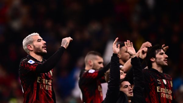 AC Milan's French defender Theo Hernandez (L) and teammates acknowledge the public at the end of during the Italian Serie A football match between AC Milan and Atalanta on February 26, 2023 at the San Siro stadium in Milan. (Photo by Marco BERTORELLO / AFP)