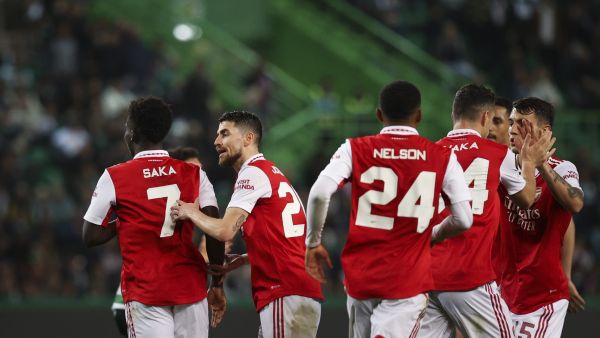 Arsenal's players celebrate after Sporting Lisbon's Japanese midfielder Hidemasa Morita scored an own goal during the UEFA Europa League last 16 first leg football match between Sporting CP and Arsenal at Jose Alvalade stadium in Lisbon on March 9, 2023. (Photo by FILIPE AMORIM / AFP)