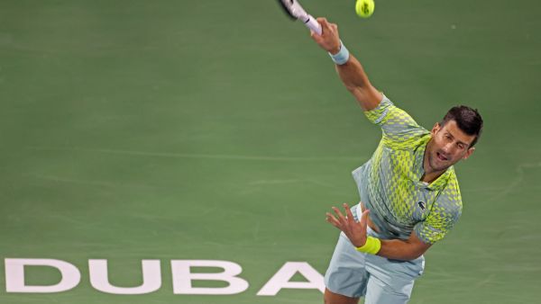 Serbia's Novak Djokovic hits a return against Netherlands' Tallon Griekspoor during their Dubai Duty Free Tennis Championship match in Dubai on March 1, 2023. (Photo by Karim SAHIB / AFP)