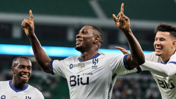 Hilal's Nigerian forward Odion Ighalo (C) celebrates with teammates after scoring his fourth goal during the AFC Champions League semi-final football match between al-Duhail and al-Hilal at al-Thumama Stadium in Doha on February 26, 2023. (Photo by KARIM JAAFAR / AFP) 