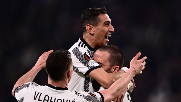 Juventus' Argentinian forward Angel Di Maria (C) celebrates with Juventus' Italian defender Leonardo Bonucci (R) and Juventus' Serbian forward Dusan Vlahovic after opening the scoring during the UEFA Europa League round of 16 first leg football match between Juventus and SC Freiburg on March 9, 2023 at the Juventus stadium in Turin. (Photo by Marco BERTORELLO / AFP)