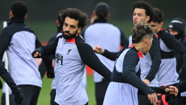 Liverpool's Egyptian striker Mohamed Salah (L) and teammates take part in a team training session at the AXA Training Centre in Liverpool, north-west England on February 20, 2023, on the eve of the UEFA Champions League round of 16 first leg football match against Real Madrid. (Photo by Lindsey Parnaby / AFP)