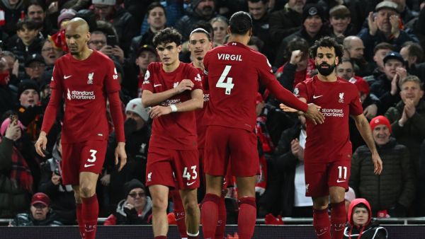 Liverpool's Egyptian striker Mohamed Salah (R) celebrates scoring the team's second goal during the English Premier League football match between Liverpool and Wolverhampton at Anfield in Liverpool, north west England on March 1, 2023. (Photo by Paul ELLIS / AFP)