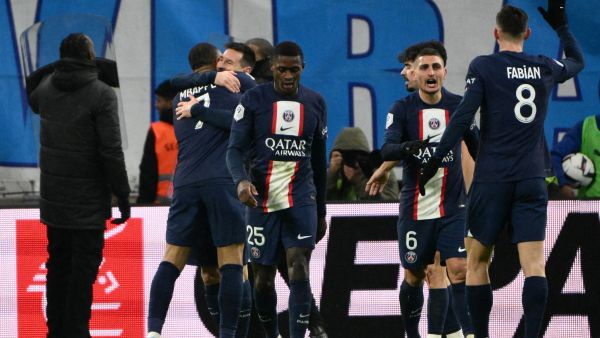 Paris Saint-Germain's players celebrate after Argentine forward Lionel Messi scored a goal during the French L1 football match between Olympique Marseille (OM) and Paris Saint-Germain (PSG) at the Velodrome stadium in Marseille, southern France on February 26, 2023. (Photo by CHRISTOPHE SIMON / AFP)