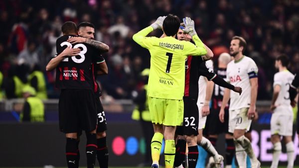 AC Milan's Bosnian midfielder Rade Krunic (2ndL) embraces AC Milan's German-Finnish defender Malick Thiaw as AC Milan's Romanian goalkeeper Ciprian Tatarusanu (C) reacts at the end of the UEFA Champions League round of 16, first leg football match between AC Milan and Tottenham Hotspur on February 14, 2023 at the San Siro stadium in Milan. (Photo by Marco BERTORELLO / AFP)