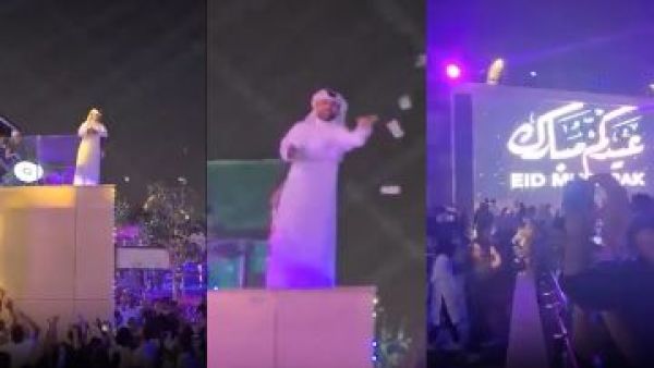 قطري يوزع المال على المارة بطريقة مهينة 