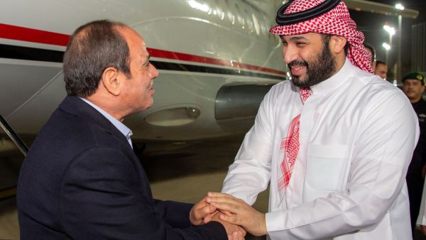 In this handout picture obtained from the Saudi Royal Palace, Crown Prince Mohammed bin Salman (R) welcomes Egypt's President Abdel Fattah el-Sisi in Jeddah late on April 2, 2023. (Photo by Saudi Royal Palace / AFP) Abdel Fattah el-Sisi