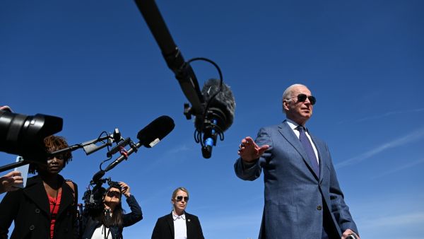 US President Joe Biden speaks to the press before boarding Air Force One, as he departs for Northern Ireland, at Joint Base Andrews in Maryland on April 11, 2023. (Photo by Jim WATSON / AFP)