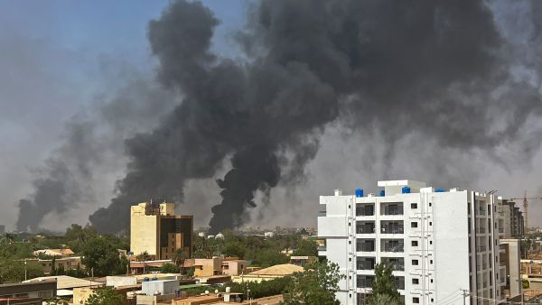 Smoke billows above residential buildings in Khartoum on April 16, 2023, as fighting in Sudan raged for a second day in battles between rival generals. (Photo by AFP) Sudan