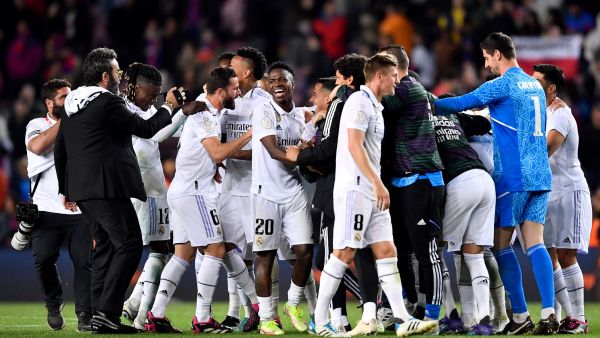 Real Madrid's players celebrate at the end of the Copa del Rey (King's Cup) semi-final second leg football match between FC Barcelona and Real Madrid CF at the Camp Nou stadium in Barcelona on April 5, 2023. (Photo by Pau BARRENA / AFP)