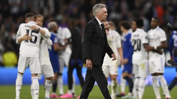 Real Madrid's Italian coach Carlo Ancelotti walks on the pitch at the end of the UEFA Champions League quarter final first leg football match between Real Madrid CF and Chelsea FC at the Santiago Bernabeu stadium in Madrid on April 12, 2023. (Photo by OSCAR DEL POZO / AFP)