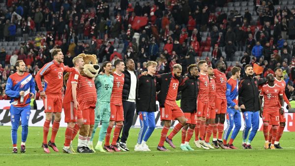 Bayern Munich's team celebrates after the German first division Bundesliga football match between FC Bayern Munich and BVB Borussia Dortmund in Munich, southern Germany, on April 1, 2023. (Photo by KERSTIN JOENSSON / AFP)