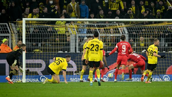Leipzig's Swedish midfielder Emil Forsberg (2R) scores during the German first division Bundesliga football match between Borussia Dortmund and RB Leipzig in Dortmund on March 3, 2023. (Photo by INA FASSBENDER / AFP)