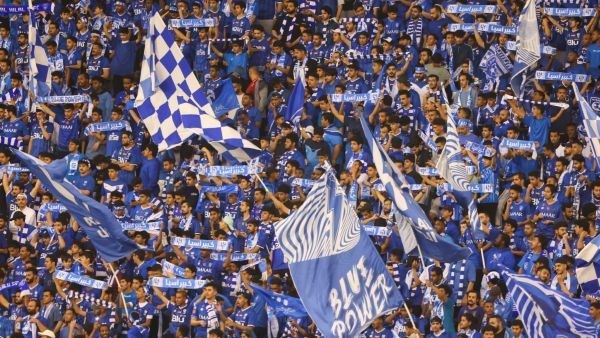 Fans of Al-Hilal cheer during the Saudi Pro League football match between Al-Hilal and Al-Nassr at the Prince Faisal Bin Fahd stadium in the capital Riyadh on April 18, 2023. (Photo by Fayez Nureldine / AFP)