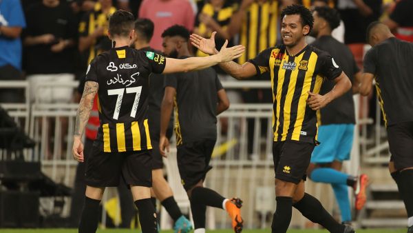 Ittihad's forward Romarinho (R) celebrates his goal with a teammate during a Saudi Pro League football match between al-Ittihad and al-Hilal at the King Abdullah Sports City in Jeddah on May 23, 2022. (Photo by AFP)
