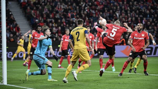 Leverkusen's Dutch defender Mitchel Bakker (2R) controls the ball during the UEFA Europa League Group Quarter final First Leg football match between Bayer Leverkusen and Union St-Gilloise in Leverkusen, on April 13, 2023. (Photo by INA FASSBENDER / AFP)