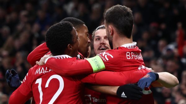 Manchester United's Austrian midfielder Marcel Sabitzer (2R) celebrates scoring the opening goal with during the UEFA Europa league quarter-final, first leg football match between Manchester United and Sevilla at Old Trafford stadium in Manchester, north west England, on April 13, 2023. (Photo by Darren Staples / AFP)
