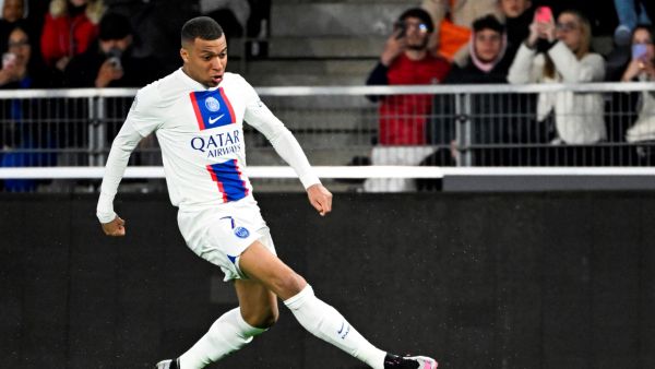 Paris Saint-Germain's French forward Kylian Mbappe runs with the ball during the French L1 football match between SCO Angers and Paris Saint-Germain (PSG) at The Raymond-Kopa Stadium in Angers, western France on April 21, 2023. (Photo by DAMIEN MEYER / AFP)