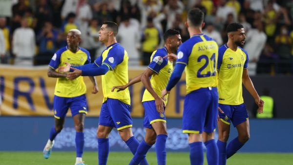 Nassr's players celebrate scoring during the Saudi Pro League football match between Abha and al-Nassr at Mrsool Park Stadium in Riyadh on March 18, 2023. (Photo by Fayez NURELDINE / AFP)