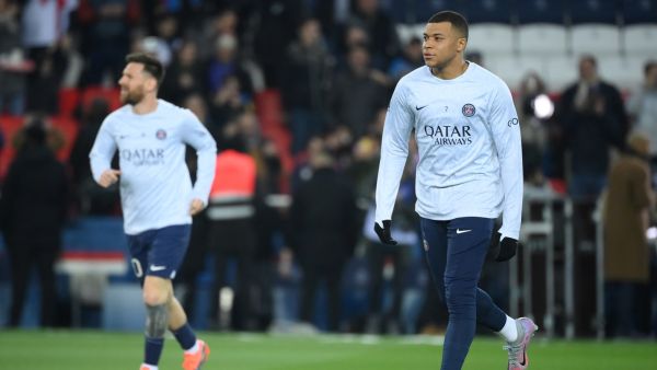 Paris Saint-Germain's French forward Kylian Mbappe (R) and Paris Saint-Germain's Argentine forward Lionel Messi warm up before the French L1 football match between Paris Saint-Germain (PSG) and Olympique Lyonnais (OL) at The Parc des Princes Stadium in Paris on April 2, 2023. (Photo by FRANCK FIFE / AFP)