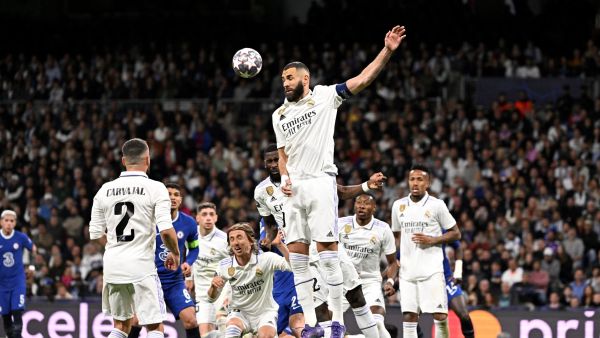 Real Madrid's French forward Karim Benzema heads the ball during the UEFA Champions League quarter final first leg football match between Real Madrid CF and Chelsea FC at the Santiago Bernabeu stadium in Madrid on April 12, 2023. (Photo by JAVIER SORIANO / AFP)