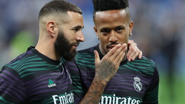 Real Madrid's French forward Karim Benzema and Real Madrid's Brazilian defender Eder Militao (R) talk as they warm up prior the Spanish league football match between Real Madrid CF and RC Celta de Vigo at the Santiago Bernabeu stadium in Madrid on April 22, 2023. (Photo by Thomas COEX / AFP)