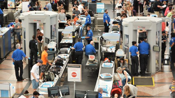 Denver, CO, USA. July 27, 2019. Travelers in long lines at Denver International Airport going thru the Transportation Security Administrations (TSA) security screening areas to get to their flights.