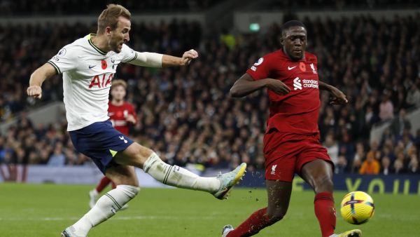 Tottenham Hotspur's English striker Harry Kane (L) scores his team's first goal past Liverpool's French defender Ibrahima Konate (R) during the English Premier League football match between Tottenham Hotspur and Liverpool at Tottenham Hotspur Stadium in London, on November 6, 2022. (Photo by Ian Kington / AFP)