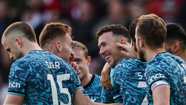 Tottenham Hotspur's Croatian midfielder Ivan Perisic (C) celebrates with teammates after scoring his team third goal during the English Premier League football match between Southampton and Tottenham Hotspur at St Mary's Stadium in Southampton, southern England on March 18, 2023. (Photo by Adrian DENNIS / AFP) 
