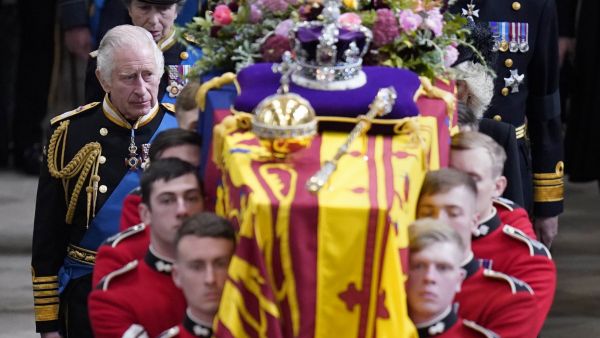 King Charles III and members of the royal family follow the coffin of Queen Elizabeth II, draped in the Royal Standard with the Imperial State Crown and the Sovereign's orb and sceptre, as it is carried out of Westminster Abbey after her State Funeral on September 19, 2022. (Photo by Danny Lawson / POOL / AFP) King Charles III, Queen Elizabeth
