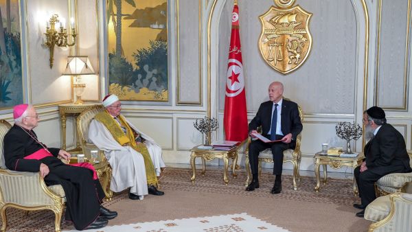 A handout picture provided by the Tunisian Presidency Press Service on May 17, 2023, shows Tunisian President Kais Saied (2-R) meeting with his country's Bishop Ilario Antoniazzi (L) Chief Rabbi Bitten Haiem (R) and Mufti Hichem Ben Mahmoud (2-L) at the Carthage Palace in Tunis. (Photo by Tunisian Presidency / AFP) Tunisian president Ghriba Synagogue