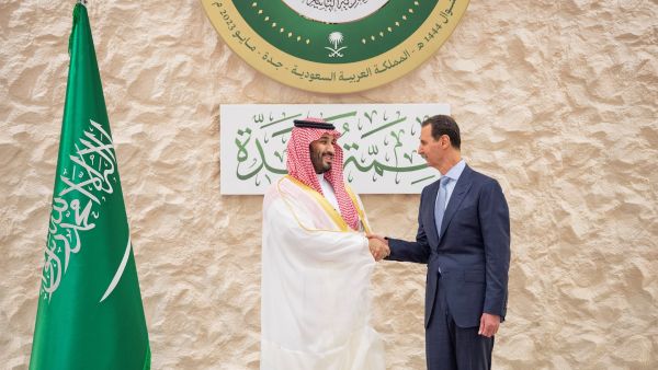 This handout picture provided by the Saudi Royal Palace on May 19, 2023 shows Saudi Crown Prince Mohammed bin Salman (L) shaking hands with Syria's President Bashar al-Assad on the sidelines of the Arab Summit meeting in Jeddah. (Photo by Bandar AL-JALOUD / Saudi Royal Palace / AFP) Syria, Saudi Arabia
