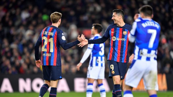 Barcelona's Dutch midfielder Frenkie de Jong (L) and Barcelona's Polish forward Robert Lewandowski react during the Copa del Rey (King's Cup), quarter final football match between FC Barcelona and Real Sociedad, at the Camp Nou stadium in Barcelona on January 25, 2023. (Photo by Pau BARRENA / AFP)