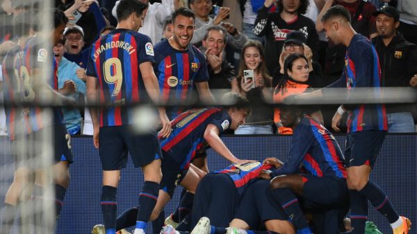 Barcelona's players celebrate their goal scored by Spanish defender Jordi Alba during the Spanish league football match between FC Barcelona and CA Osasuna at the Camp Nou stadium in Barcelona on May 2, 2023. (Photo by LLUIS GENE / AFP)
