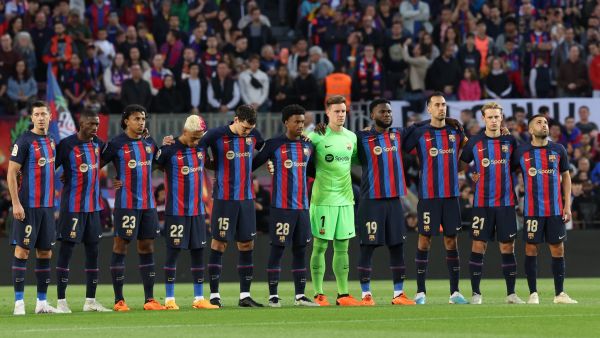 Barcelona's players line up before the start of the Spanish league football match between FC Barcelona and Real Sociedad at the Camp Nou stadium in Barcelona on May 20, 2023. (Photo by Lluis GENE / AFP)